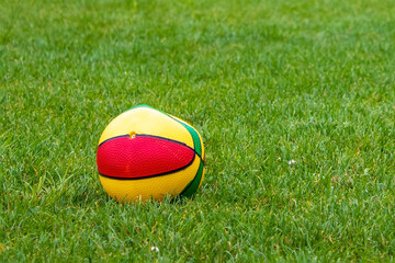 Ball for Playing with Children on a Football Field With Natural Turf. Ball Against the Background of a Football Goal on a Sunny Day Outdoors