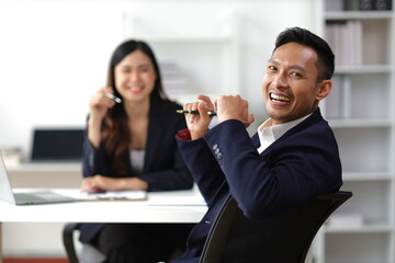 Portrait of colleagues working together in business enterprise office.
