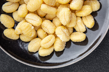 gnocchi raw potato food delicious second course Cooking appetizer meal food snack on the table copy space food background rustic top view keto or paleo diet vegetarian vegan food no met