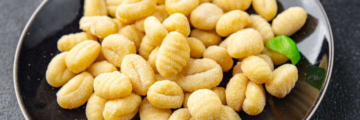gnocchi raw potato food delicious second course Cooking appetizer meal food snack on the table copy space food background rustic top view keto or paleo diet vegetarian vegan food no met