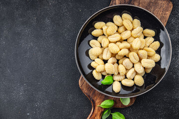 gnocchi raw potato food delicious second course Cooking appetizer meal food snack on the table copy space food background rustic top view keto or paleo diet vegetarian vegan food no met