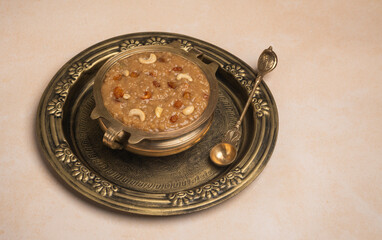 Temple Payasam in a traditional plate with brass vessel