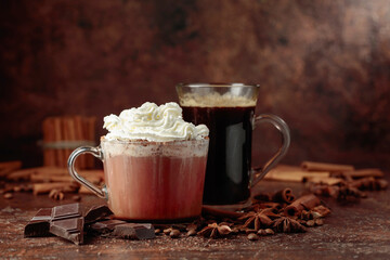 Hot chocolate with whipped cream and black coffee.