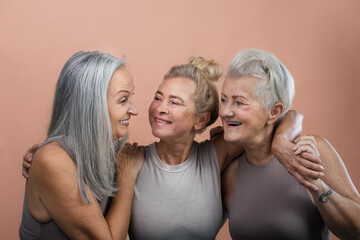 Studio portrait of three beautiful senior women with gray hairs