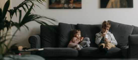Children spending time indoors while raining during summer break.