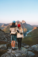 Couple in love travel together in Norway romantic vacations man and woman hiking outdoor family...