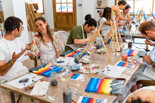 Painting Workshop. Friends having fun in painting class.