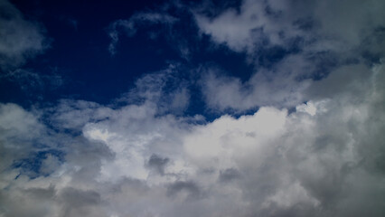Naklejka na ściany i meble Photograph of the sky with clouds forming into rain.