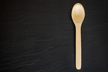 Wooden Spoon on black background