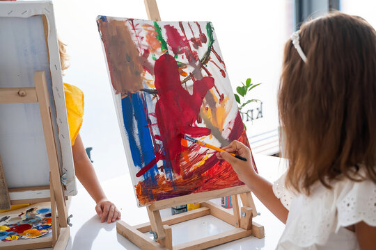 Girl At Art School Drawing Paint Acrylic Canvas and Easel in Art Class