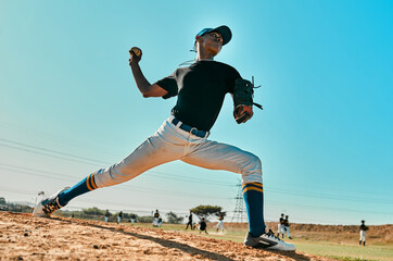 He has a strong throwing arm. Shot of a young baseball player pitching the ball during a game outdoors. - obrazy, fototapety, plakaty