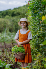 Portrait of a cute little girl in an autumn garden.