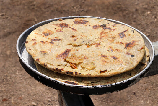 Gujarati traditional sorghum ki roti or pearl millet flat bread. farmer's lunch or common items eaten in lunch which are bajre ki roti. Jowar Roti or Indian bread, eaten by working class in rural area