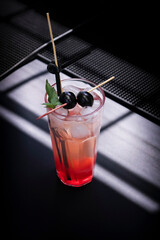 A crisp and refreshing gin fizz cocktail made with fresh cherries and lime juice