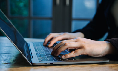 close up hands multitasking man using tablet, laptop and cellphone connecting wifi