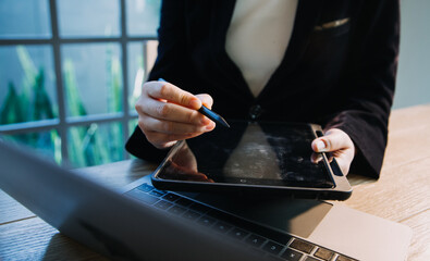 close up hands multitasking man using tablet, laptop and cellphone connecting wifi