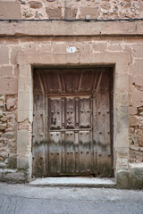 Fototapeta na wymiar old wooden door at ancient village of Badaran, La Rioja, Spain
