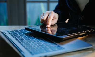 close up hands multitasking man using tablet, laptop and cellphone connecting wifi