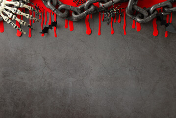 Macabre Halloween setup: Overhead photo highlighting thematic elements including eerie spiders,...