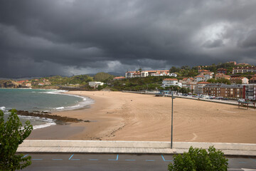 Fototapeta na wymiar Cantabrian sea beach. Beach in the town of Comillas, in Santander (Spain) 