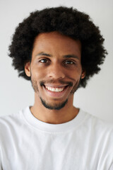 Obraz premium Portrait of positive Black man with toothy smile looking at camera