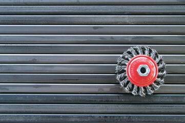 brush for cleaning metal. cutting abrasive wheel. Preparing pipes for fence construction.