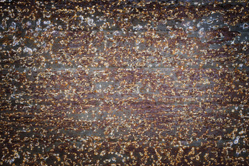 Detail of a rusty iron plate with a lot of texture and contrast. Concept backgrounds and templates.