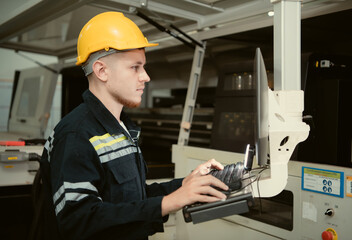 After the machinery was installed, young man engineers inspected and tested it.