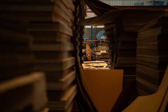 Warehouse staff working of paper products, Paper storage foreground and background