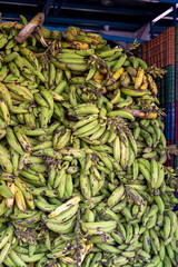 Stacked boxes with tropical fruits and a heap of green bananas on a ferry to Manaus in Brazil, South America