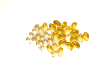 yellow capsules on a white background. medicines and vitamins