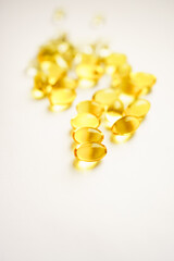 yellow capsules on a white background. medicines and vitamins