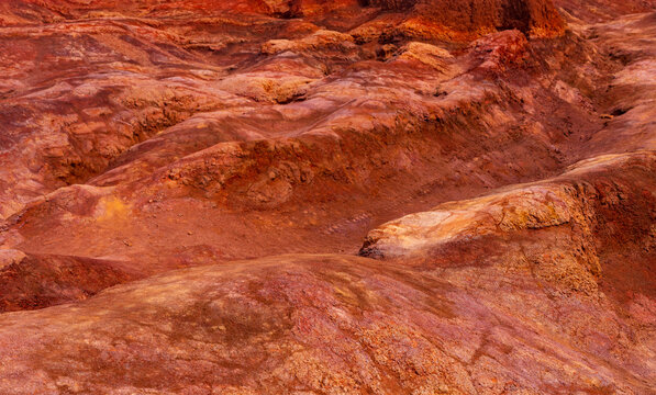 Iron oxide and clay in detail image of the red rocks of Waimea canyon on Hawaiian island of Kauai