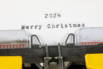 Merry Christmas 2024 written on an old typewriter	

