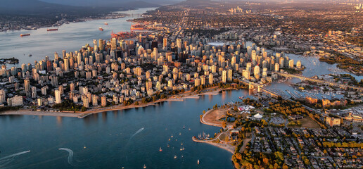 Aerial View of Stanley Park and Downtown Vancouver City on Ocean Coast. Sunset