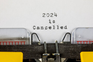 written on old typewriter with text 2024 is cancelled. Covid-19, Coronavirus, 2024 is Cancelled	
