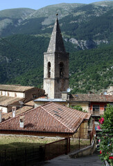 Obraz premium Enjoy a charming view of the bell tower of Santa Maria della Valle Church nestled within the small village of Scanno, Italy. This picturesque scene captures the essence of historical beauty