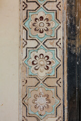 Close up of the painted floral motifs at the entrance of the Qutub Shahi Tombs in Hyderbad, Telangana, India, Asia