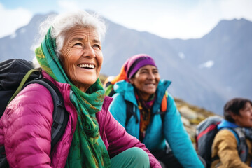 Group of senior women hiking with friends on the mountain, having fun together - obrazy, fototapety, plakaty