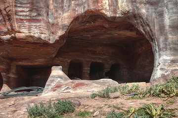 View of the caves and dwellings carved into the sandstone rock. Petra, Jordan.