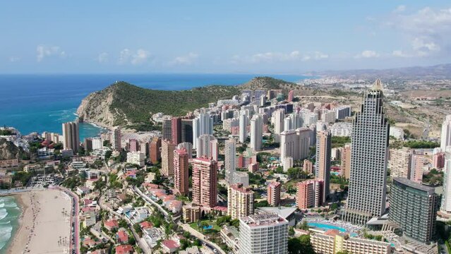 Aerial drone view of impressive Benidorm skyline. Vacation holiday rentals or apartment buildings for tourists. Spanish vacation homes town. Summer destination on mediterranean coast