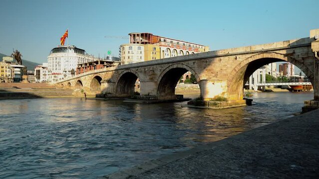 A 15th-century stone bridge connects the Ottoman Old &Ccedil;ar&scaron;ija bazaar on the north bank of the Vardar River with the modern Macedonia Square to the south. North Macedonia