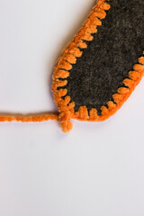 Banner with felt insole tied with plush yarn. Slippers