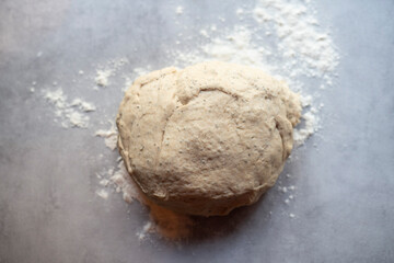 Fototapeta na wymiar dough and flour on the table