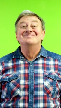 Positive caucasian man looking at camera nodding head answering yes.