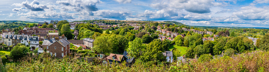 A panorama view west down from the ramparts of the castle keep in Lewes, Sussex, UK in summertime
