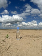 bottle of water on beach
