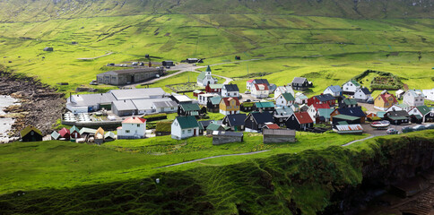 Natural harbour gorge nearby idyllic village Gjogv, most northern village of Eysturoy, Faroe islands
