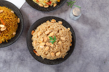 Obraz na płótnie Canvas Spicy rice with almonds and parsley