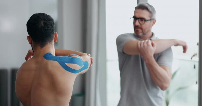 Physiotherapy, shoulder stretching and man patient with sport massage therapist at clinic. Healthcare, workout support and chiropractor with exercise and fitness rehabilitation in a consultation